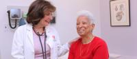 Dr. Giardina works with a patient.